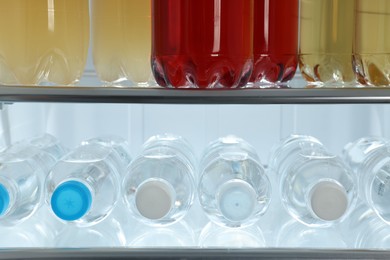 Photo of Many different cold drinks in refrigerator, closeup