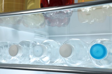 Many different cold drinks in refrigerator, closeup