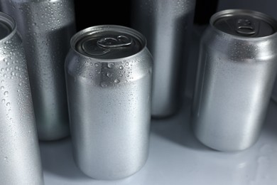 Photo of Many cans of beer in refrigerator, closeup