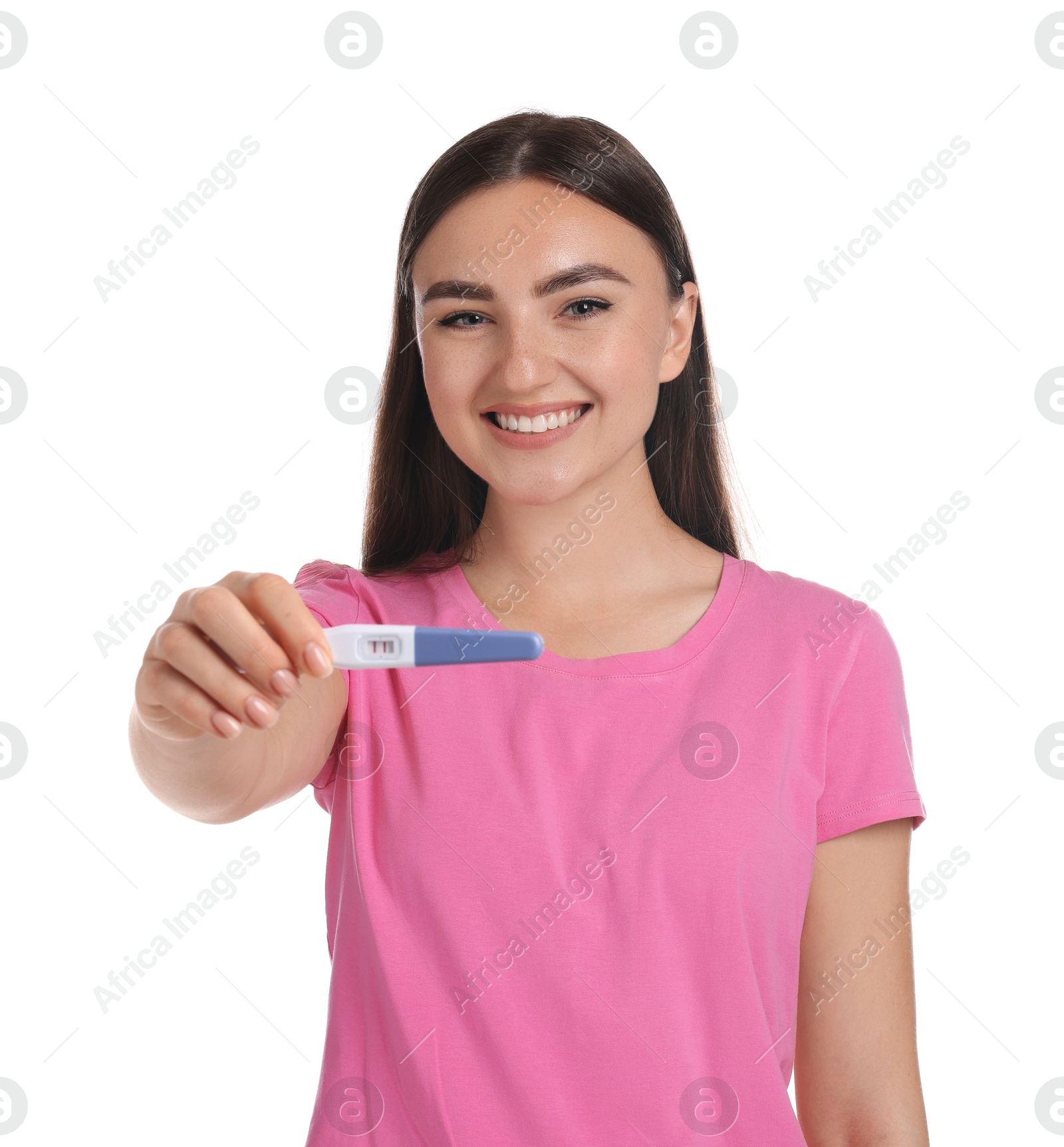 Photo of Happy woman holding pregnancy test on white background