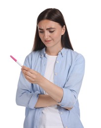 Photo of Woman holding pregnancy test on white background