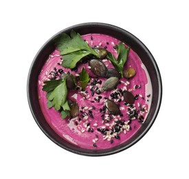 Tasty beetroot hummus, parsley and sesame in bowl isolated on white, top view