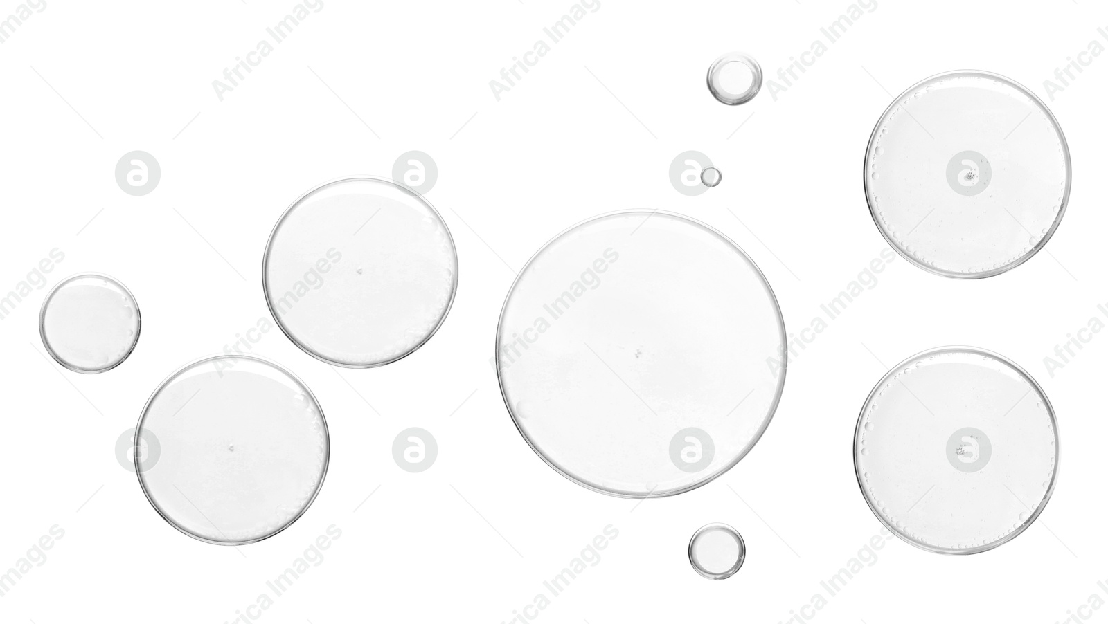 Image of Clear cosmetic oil on white background, top view