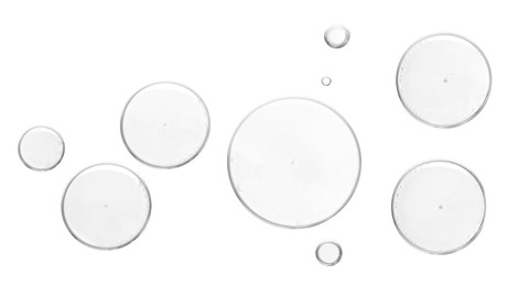 Image of Clear cosmetic oil on white background, top view