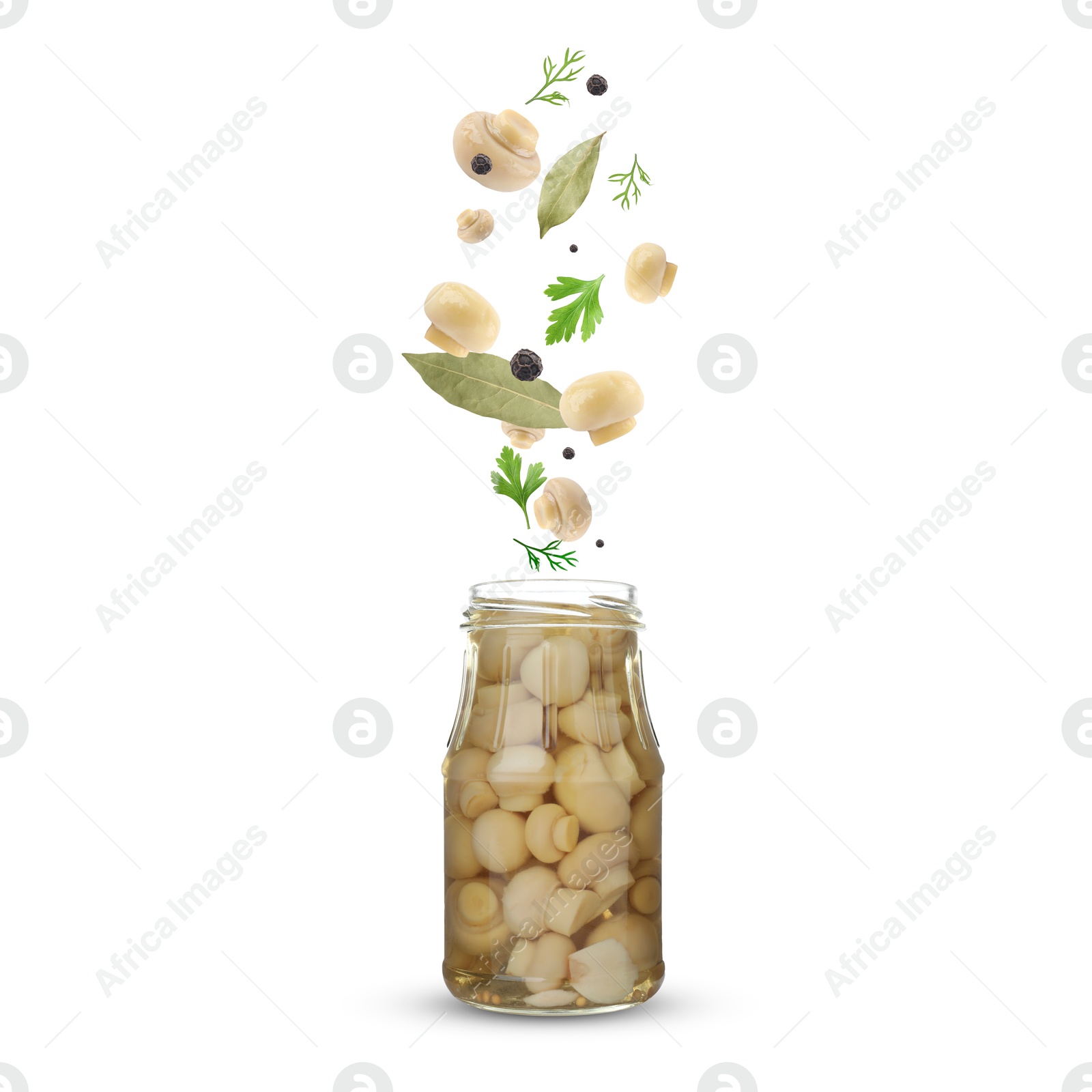 Image of Jar with pickled champignons and ingredients falling into it on white background