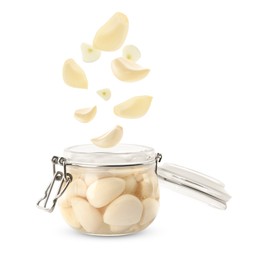 Image of Jar with pickled garlic and cloves falling into it on white background