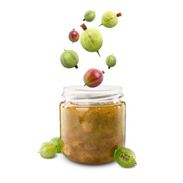 Image of Gooseberries falling into jar with berry jam on white background