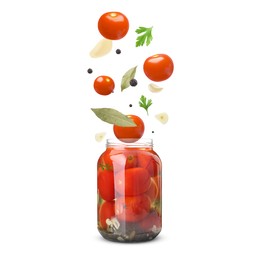 Image of Jar with pickled tomatoes and ingredients falling into it on white background