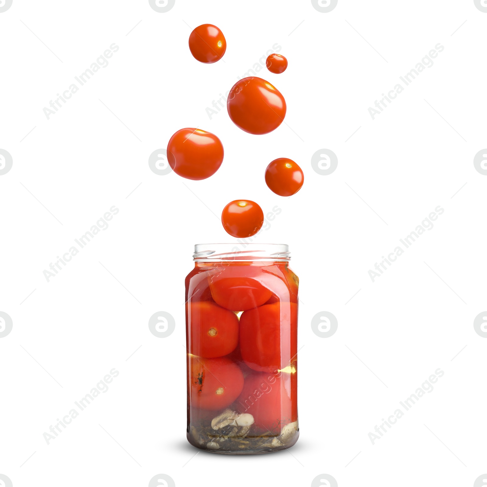 Image of Tomatoes falling into jar on white background