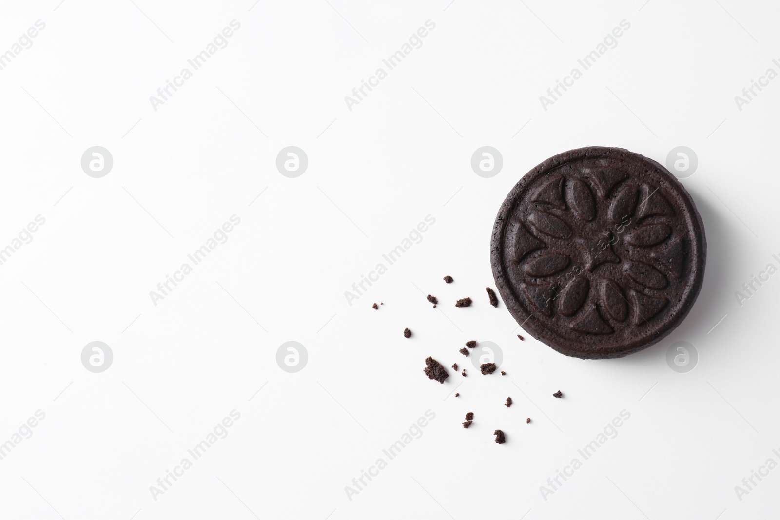 Photo of One tasty sandwich cookie on white background, top view. Space for text