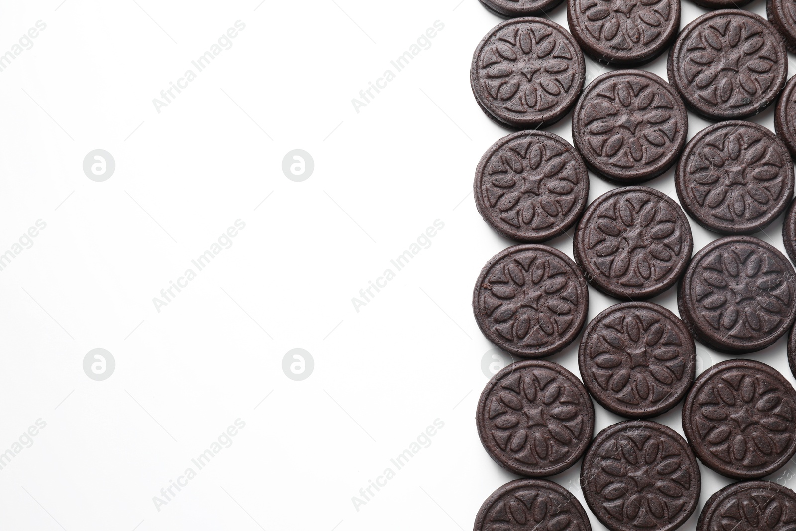 Photo of Tasty sandwich cookies on white background, top view. Space for text