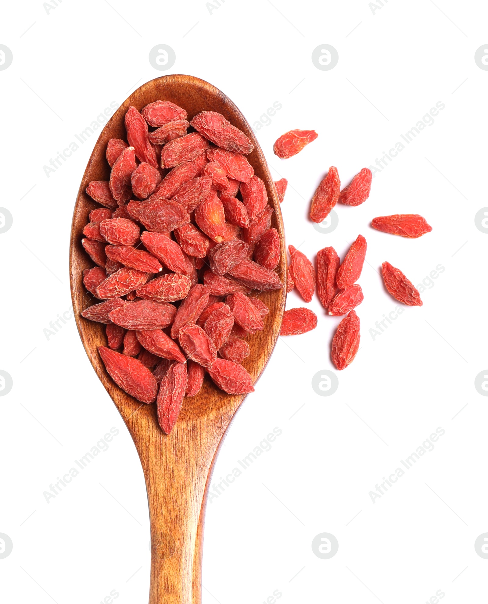 Photo of Dried goji berries and spoon isolated on white, top view