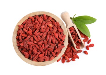 Photo of Bowl and scoop with dried goji berries isolated on white, top view