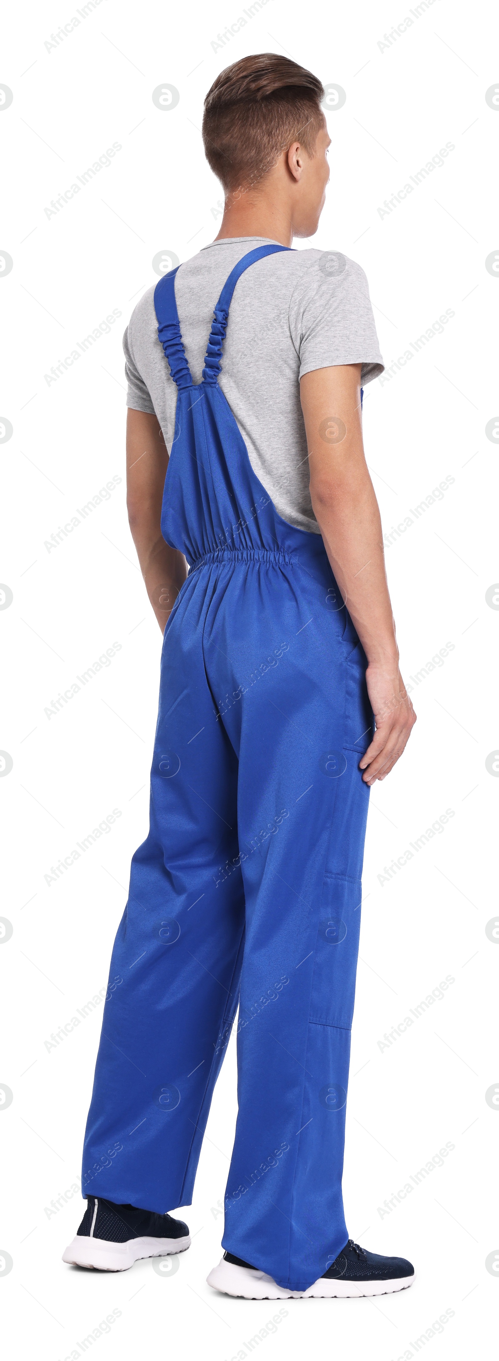 Photo of Auto mechanic in uniform on white background, back view