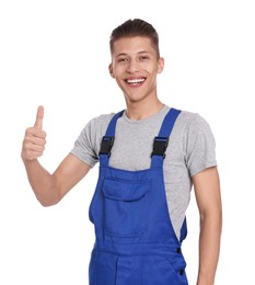 Smiling auto mechanic showing thumb up on white background