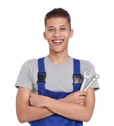 Photo of Smiling auto mechanic with wrenches on white background