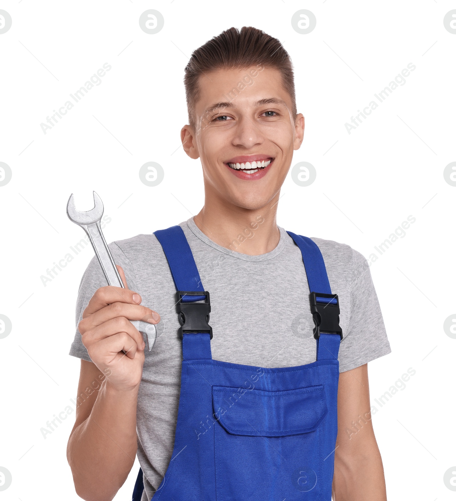 Photo of Smiling auto mechanic with wrench on white background