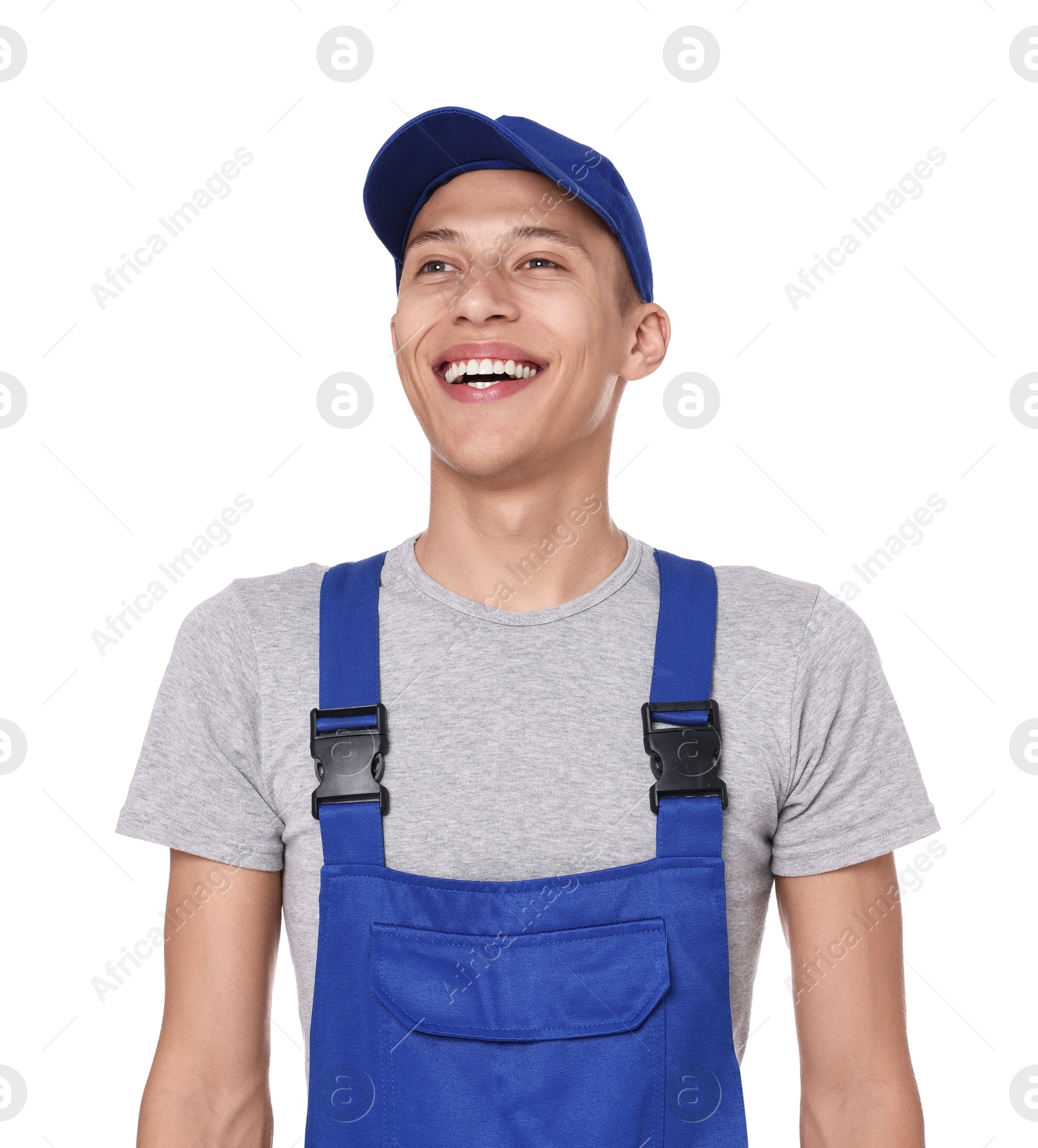 Photo of Smiling auto mechanic in uniform on white background