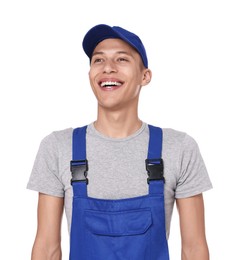 Smiling auto mechanic in uniform on white background