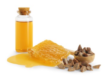 Photo of Natural honey tincture, propolis granules and sweet honeycomb isolated on white