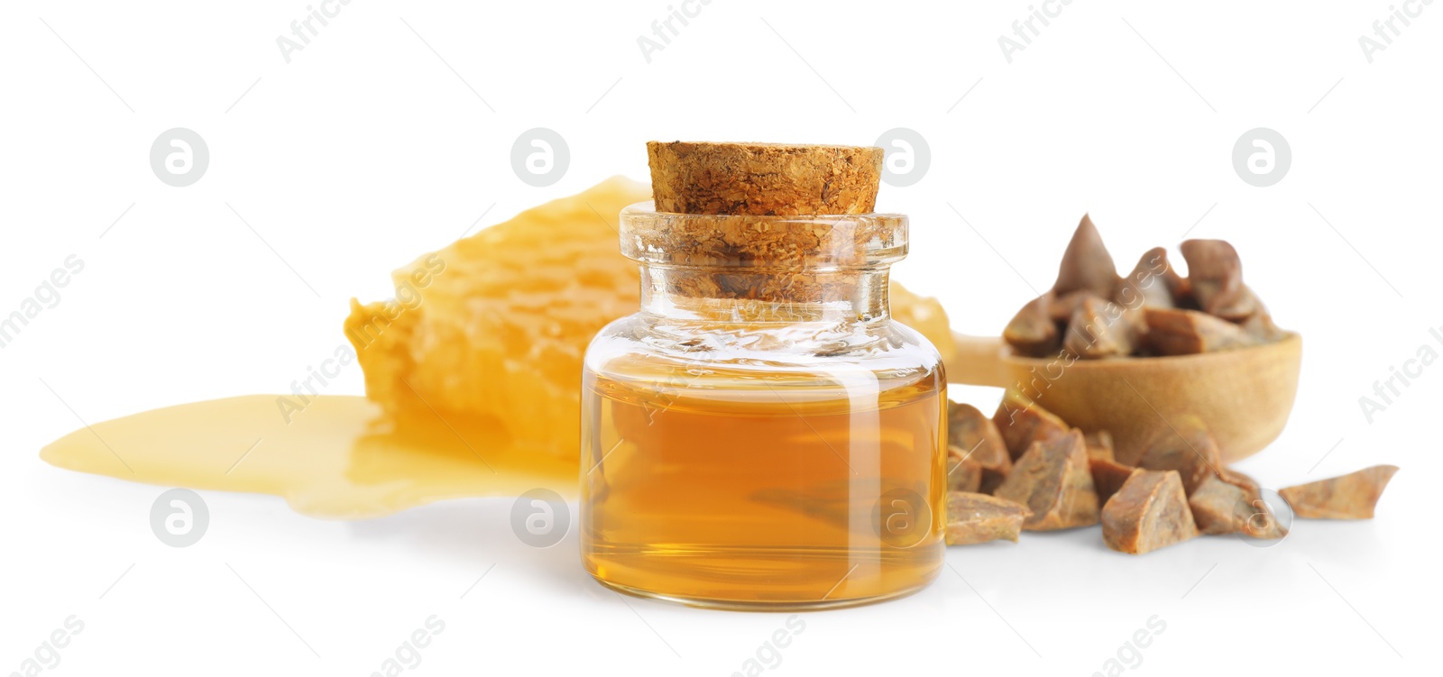 Photo of Natural honey tincture, propolis granules and sweet honeycomb isolated on white