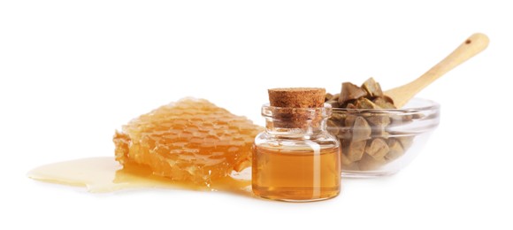 Photo of Natural honey tincture, propolis granules and sweet honeycomb isolated on white