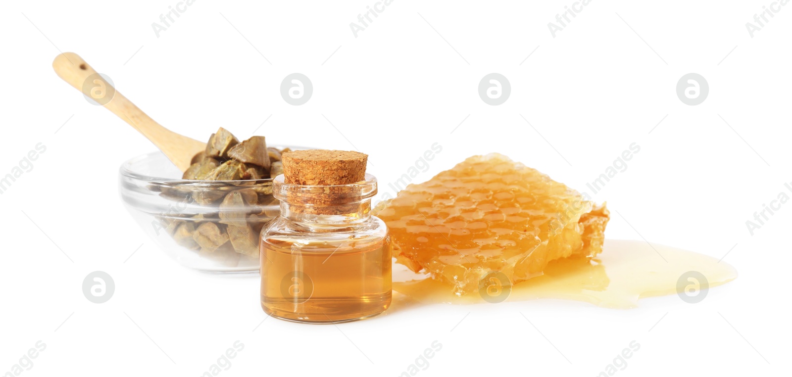 Photo of Natural honey tincture, propolis granules and sweet honeycomb isolated on white