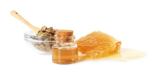 Natural honey tincture, propolis granules and sweet honeycomb isolated on white