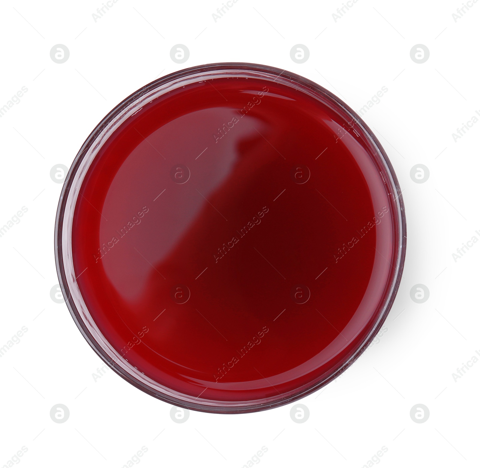 Photo of Fresh beet juice in glass isolated on white, top view