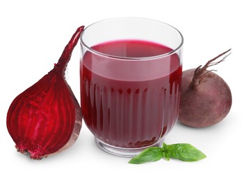 Photo of Fresh beet juice in glass, ripe vegetables and basil isolated on white