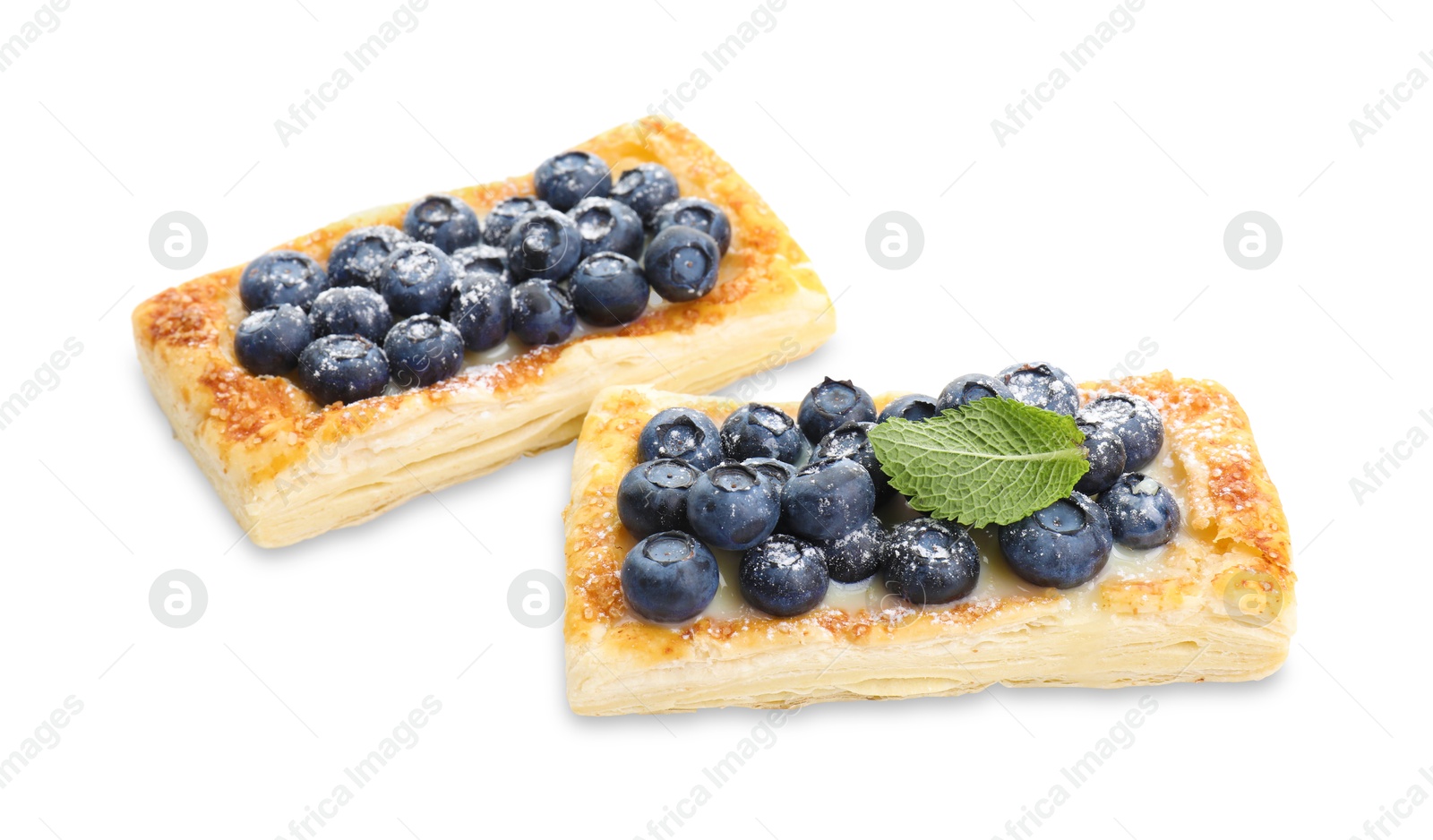 Photo of Tasty puff pastries with blueberries isolated on white