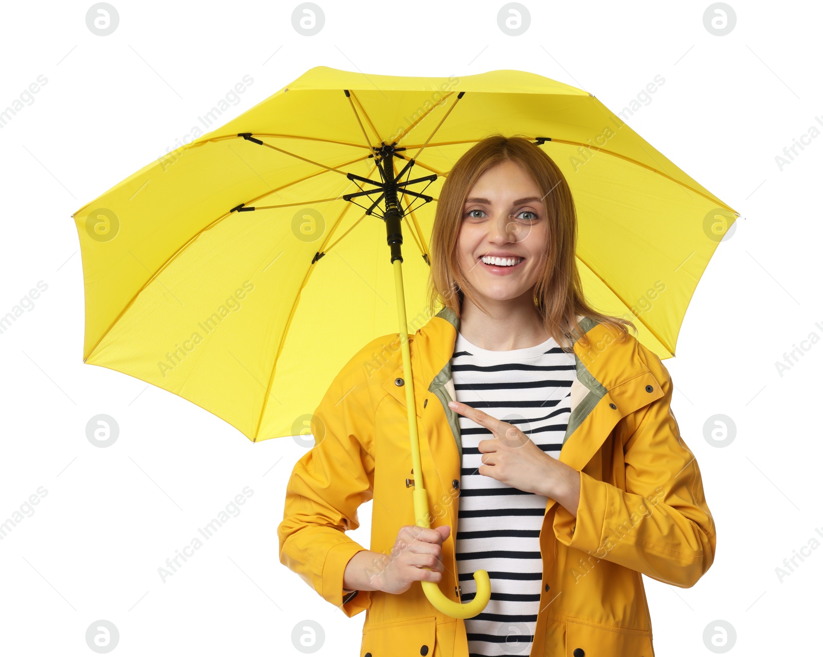 Photo of Woman with yellow umbrella pointing at something on white background