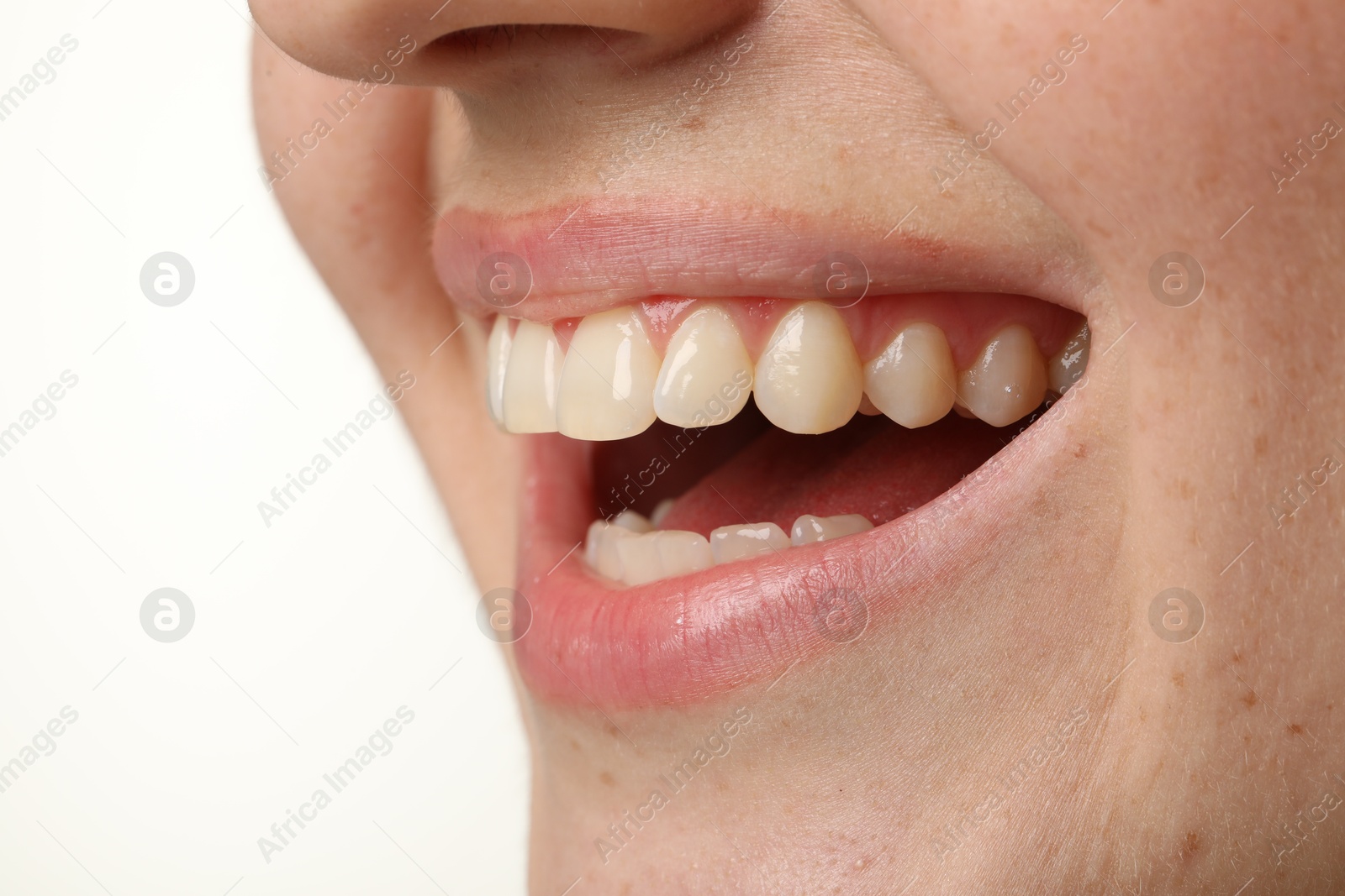 Photo of Smiling woman with healthy clean teeth on white background, closeup