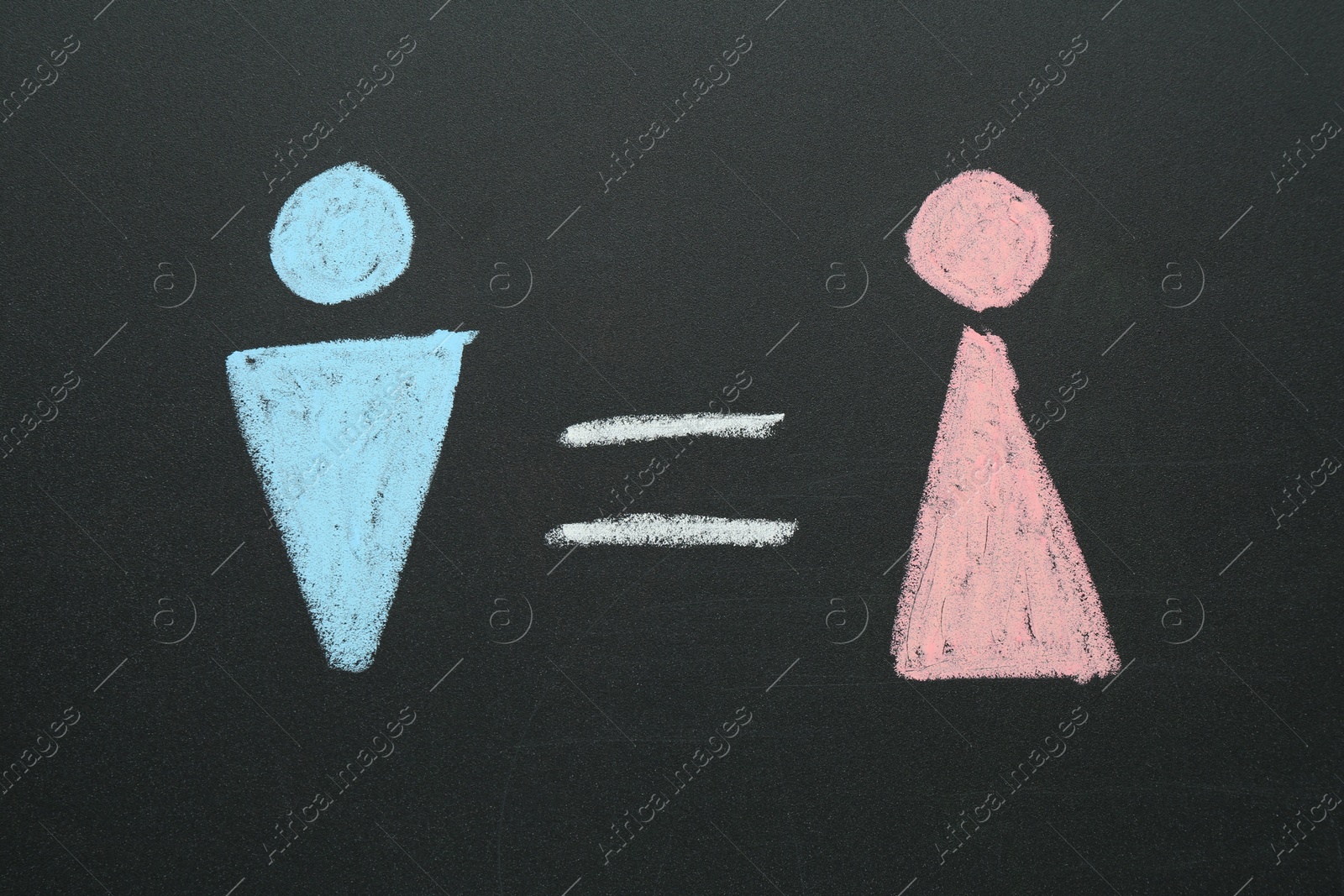 Photo of Gender equality concept. Male and female figures drawn on chalkboard, top view