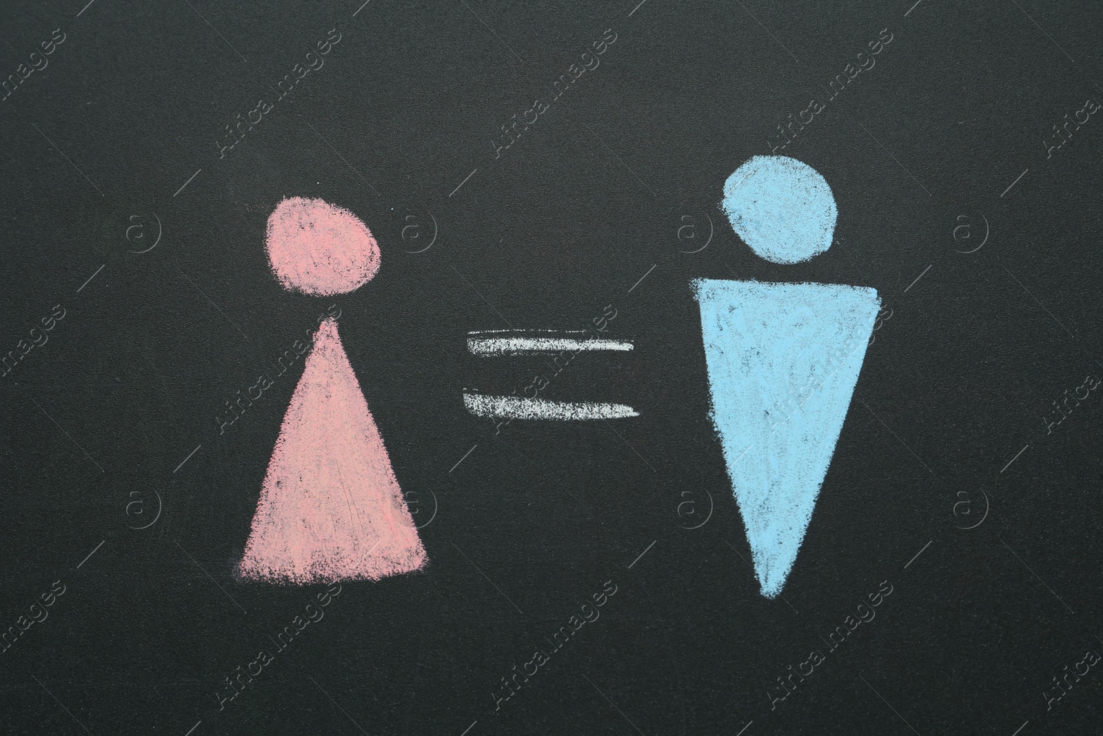 Photo of Gender equality concept. Male and female figures drawn on chalkboard, top view