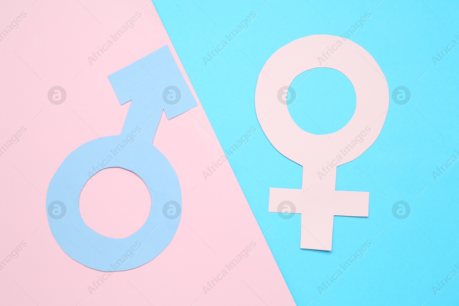 Photo of Gender equality concept. Male and female symbols on color background, flat lay