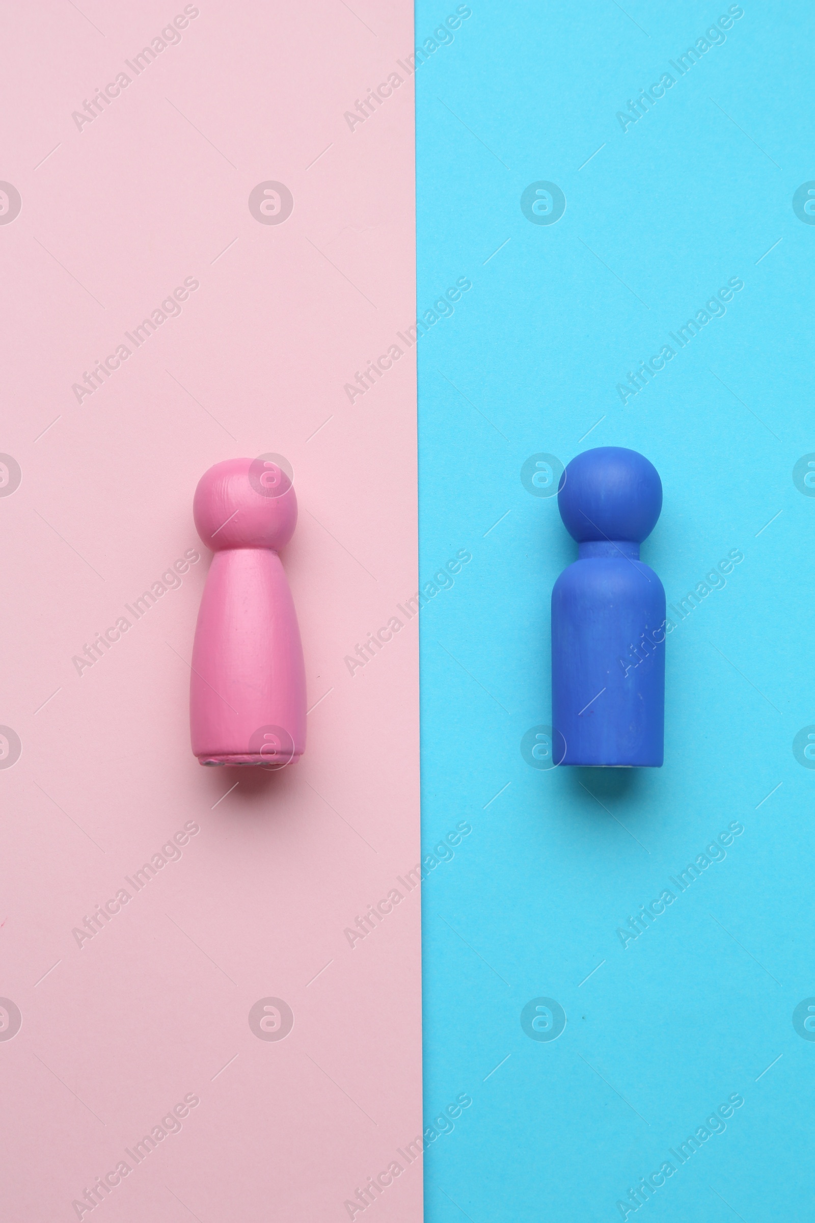 Photo of Gender equality concept. Male and female figures on color background, flat lay