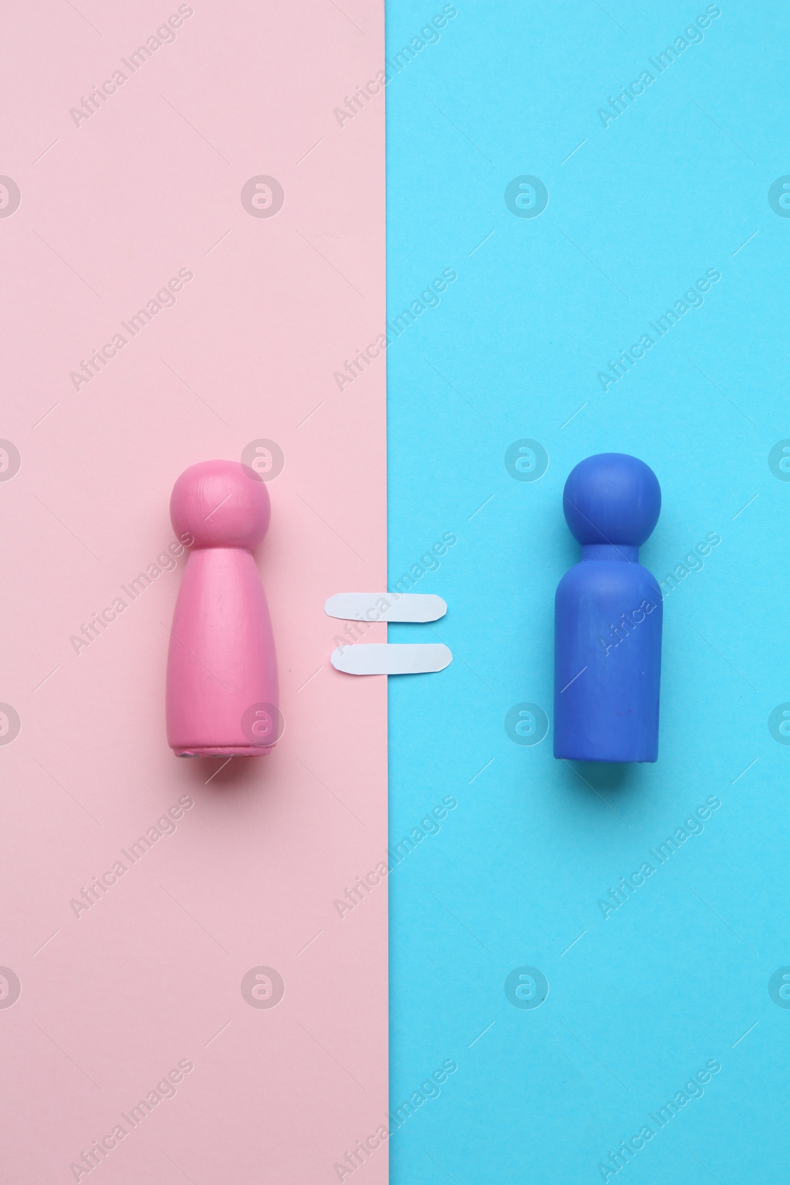 Photo of Gender equality concept. Male and female figures on color background, flat lay