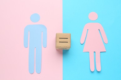 Photo of Gender equality concept. Male and female figures on color background, flat lay