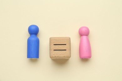 Photo of Gender equality concept. Male and female figures on beige background, flat lay