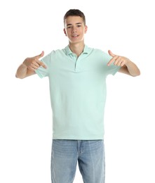 Teenage boy wearing light green t-shirt on white background