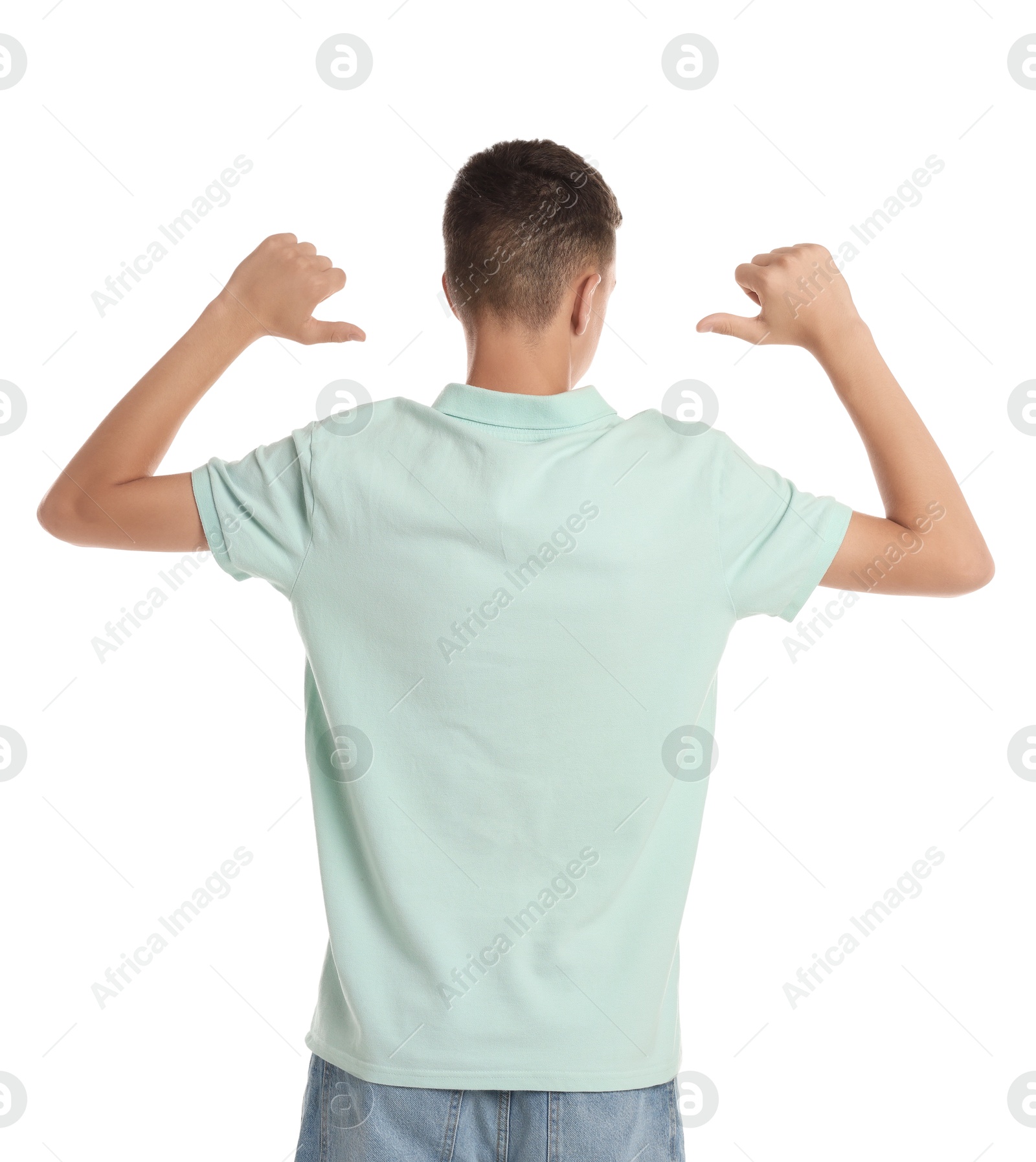 Photo of Teenage boy wearing light green t-shirt on white background, back view