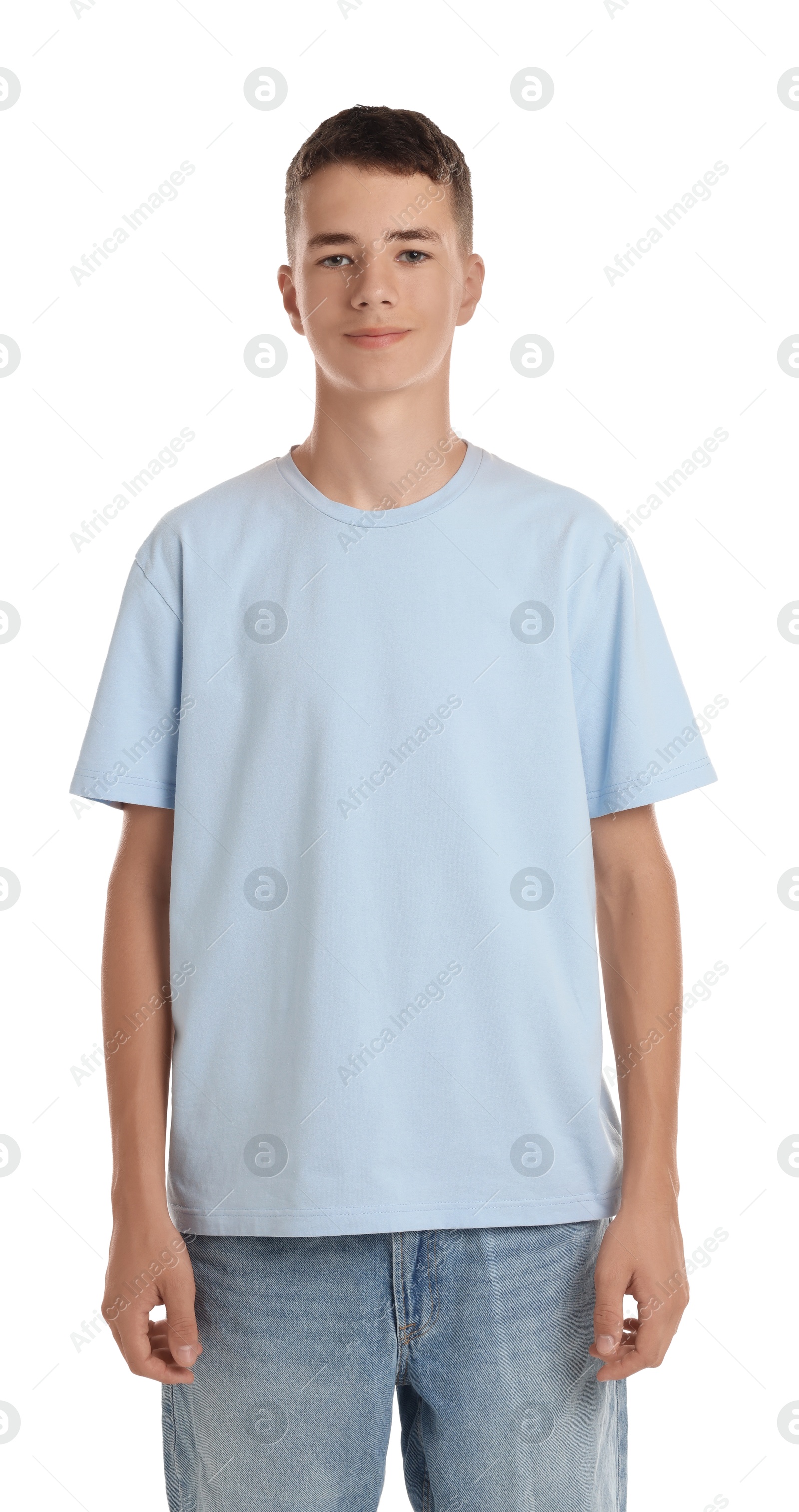 Photo of Teenage boy wearing light blue t-shirt on white background