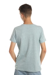 Teenage boy wearing light grey t-shirt on white background, back view