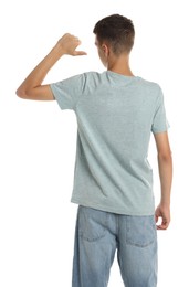 Teenage boy wearing light grey t-shirt on white background, back view