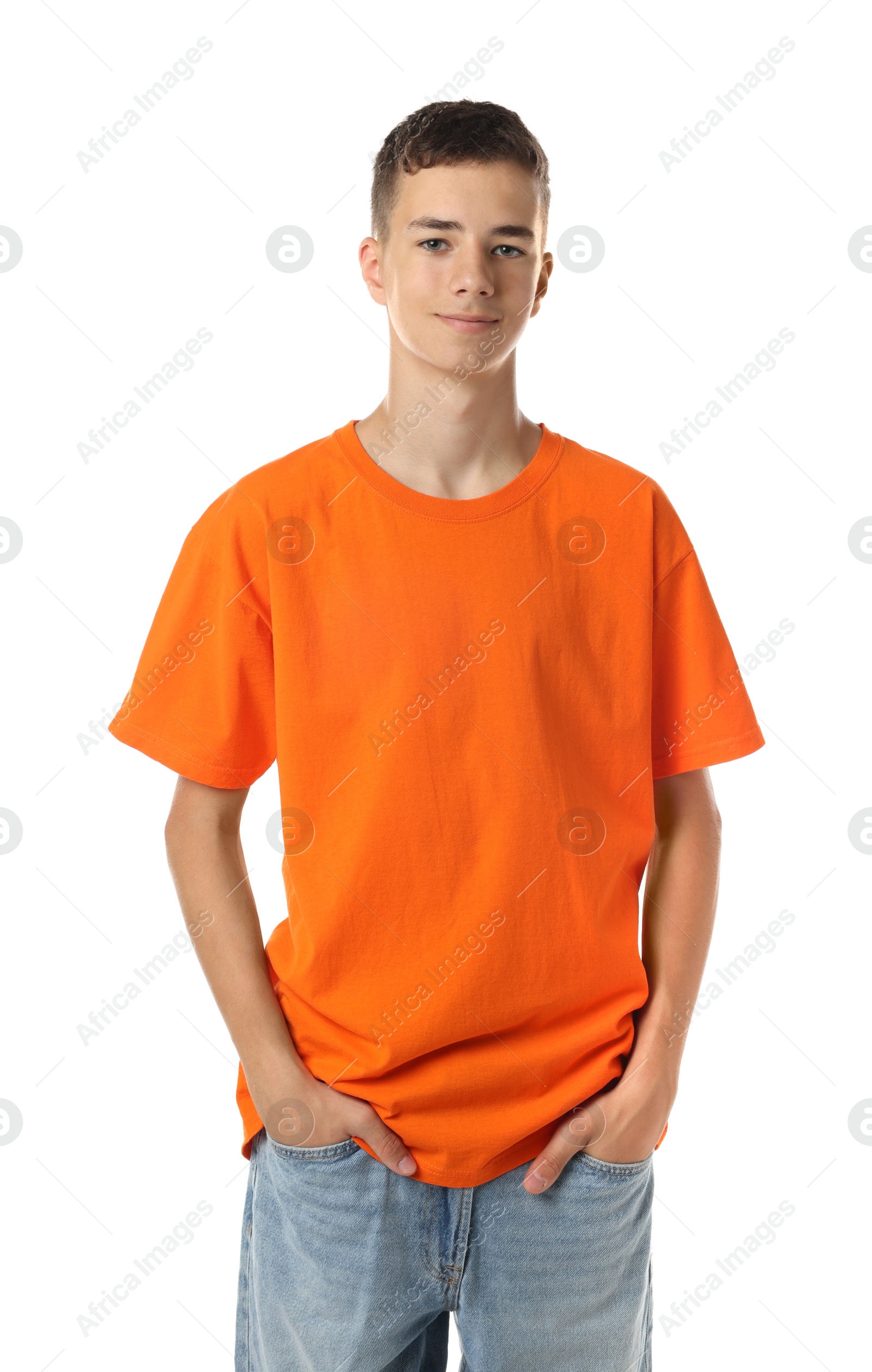 Photo of Teenage boy wearing orange t-shirt on white background