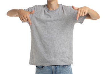 Teenage boy wearing grey t-shirt on white background, closeup