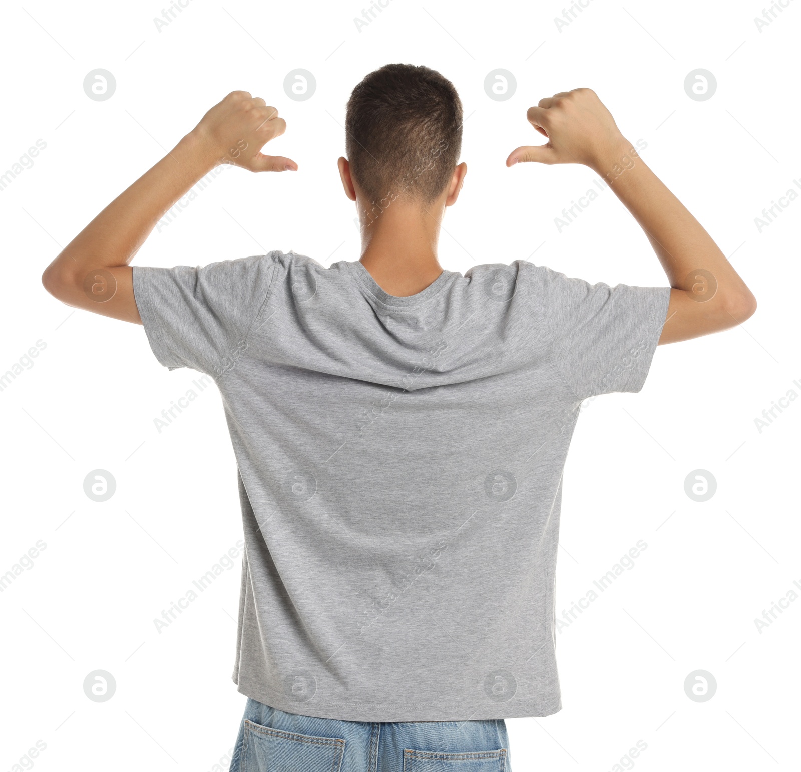 Photo of Teenage boy wearing grey t-shirt on white background, back view