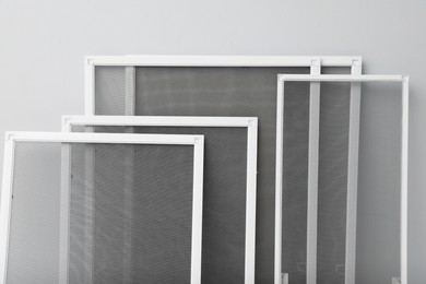 Photo of Set of window screens on light grey background