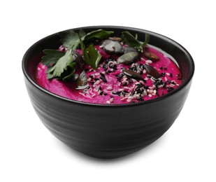 Photo of Tasty beetroot hummus, parsley and sesame in bowl isolated on white